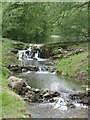 Small water cascade by roadside near Fairbourne Mill in ME17 1LH