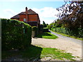 Looking along lane from footpath junction east of Park Corner Farm in GU10 5PY