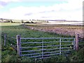 A gated entrance to a field near South Footie in AB31 4HU