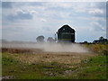 John Deere combine in the dust in PE11 4AU