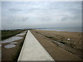 Looking along the sea wall towards St Mary's Bay in TN28 8QY