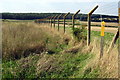 Footpath by the barbed wire fence in Campton and Chicksands