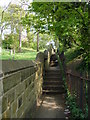 A steep footpath to the right of St Thomas' Church in S70 4AA