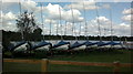 View of a row of boats moored up next to Russell's Lake in RM14 2TZ