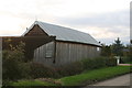 Wooden barn by bungalow in Mill Lane, Brant Broughton in Brant Broughton and Stragglethorpe