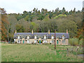 Row of cottages in Chesters Glen in TD8 6UL