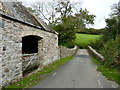 Owley Bridge over Glaze Brook, and farm buildings, Owley, near South Brent in TQ10 9HN