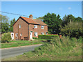 Cottages beside Lexham Road in PE32 2QH