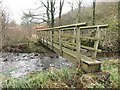 Footbridge crossing Lostrigg Beck in CA14 1WD