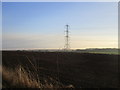 Ploughed field and pylon in HU17 8YA