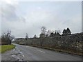 Substantial limestone wall alongside the B6001 near Hassop in DE45 1NU