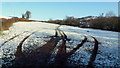 Snowy field; recent tyre tracks in LD3 0PS