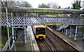 Train and footbridge at Sundridge Park Station in BR1 5AG