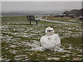 Epsom: snowman and bench at Tattenham Corner in KT18 5QJ
