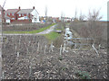 Looking northwest along a drain from Rutledge Avenue in TN25 7AE