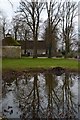 Reflections in farmyard pond at Avebury Manor in SN8 1RQ