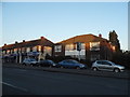 Shops and houses on Erith Road, Bexleyheath in DA7 6DY