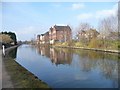 Flats reflected in the Bridgewater Canal at Gorse Hill in M32 0JX