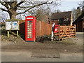 Parish notice board, telephone box and postbox in Flordon in NR15 1RP