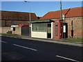 Bus stop, shelter and phone box on Main Road, Haisthorpe in YO25 4NU