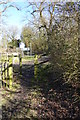 Footpath reaches Swallowfield Road from the west in RG2 9LA