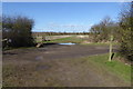 Footpath crosses farm road in RG2 9HT