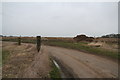 Muck heap and former gateway on the road into West Barkwith from West Torrington in West Barkwith