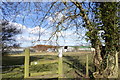 Farm buildings seen from footpath in RG2 9EA