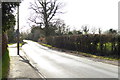 Looking eastwards on road from footpath junction in RG2 9JT