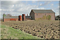 Two old boilers beside farm buildings at Tannington in IP13 7LR