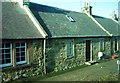 Row of Miners' Cottages on A68 in Pathead in EH37 5PP
