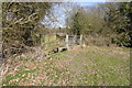 Footpath leaves field towards the A33 in RG24 8RW