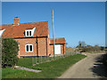 Marsh Road past Tiled Cottage in NR13 6EG