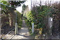 Path from the west end of Tintells Lane in KT24 6JS