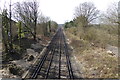 Looking west on railway line in KT24 6JS