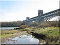 Pont Britannia viewed across the creek in LL61 5YH