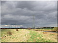 The River Hull, pylons and threatening sky in HU7 3FD