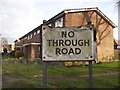 Wooden no through road sign at the entrance to Churchill Close in RH6 9QU