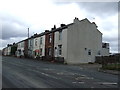 Terraced housing on Manchester Road (A6) in BL5 3NJ