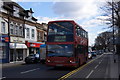 Bus on Coombe Lane, Raynes Park in SW20 0JD