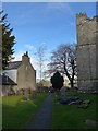 Cartmel Priory: graveyard (g) in LA11 6QD
