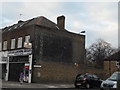 Ghost sign on the corner of Rogers Road, Tooting in SW17 0QT