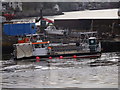 A workboat moored by the pier at Newport-on-Tay in Newport-on-Tay