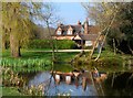 House reflected in Layters Gren Pond in SL9 8TT