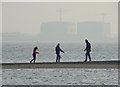 Dad and daughters on a sandbank in CO5 8BG