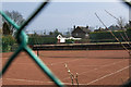 Peering through the wire fence at Stockton Heath Lawn Tennis Club in WA4 5AE