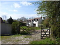 House with scaffolding through wooden gate in B60 4HL