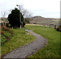 Path through The Green Community Garden, Penrhys in CF43 3AN