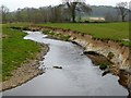 River Coly eroding its northern bank in EX24 6SQ