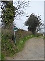 Start of a footpath along a track at the edge of Colyford in Colyford